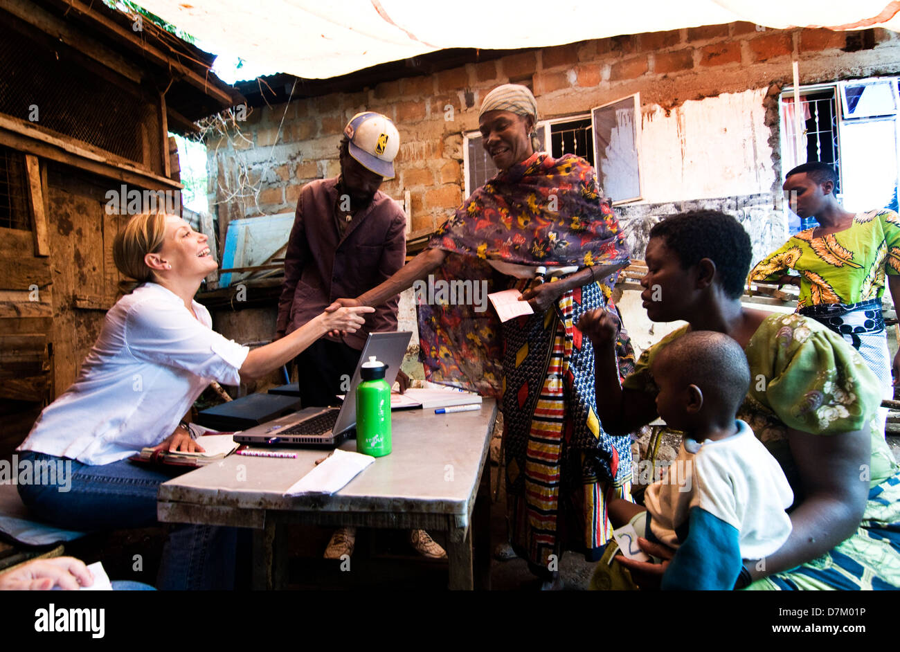 An homeopathic Dr. greets one of her patients in a rural clinic in Northern Tanzania. Stock Photo