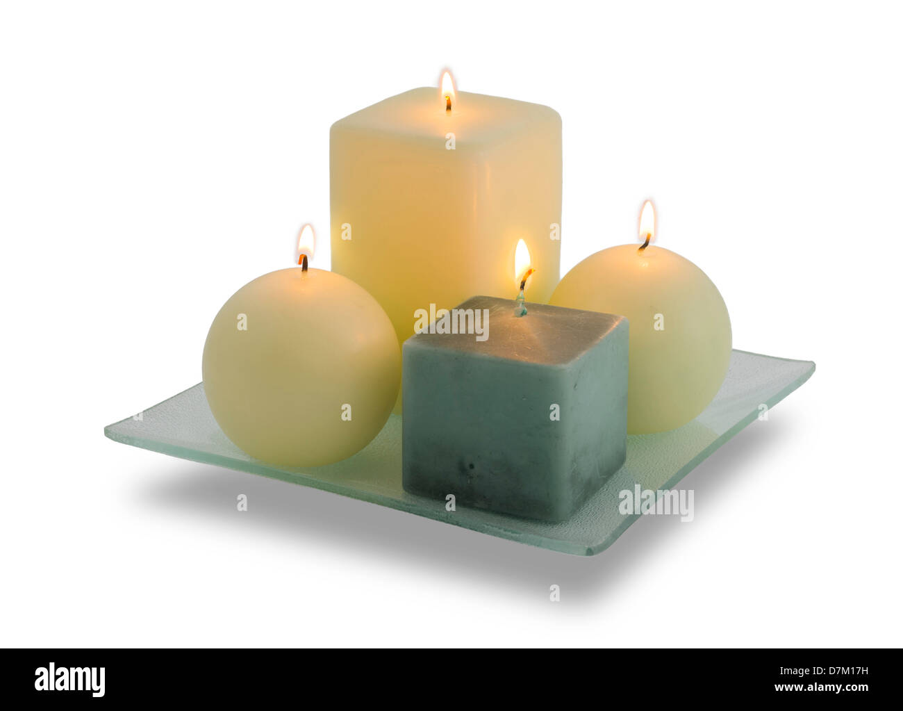 A set of four Christmas candles burning on a white background. Very clean image. Stock Photo