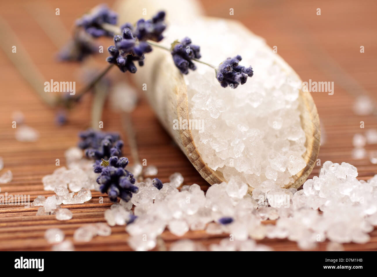 Small wooden shovel with bath salt and lavender Stock Photo