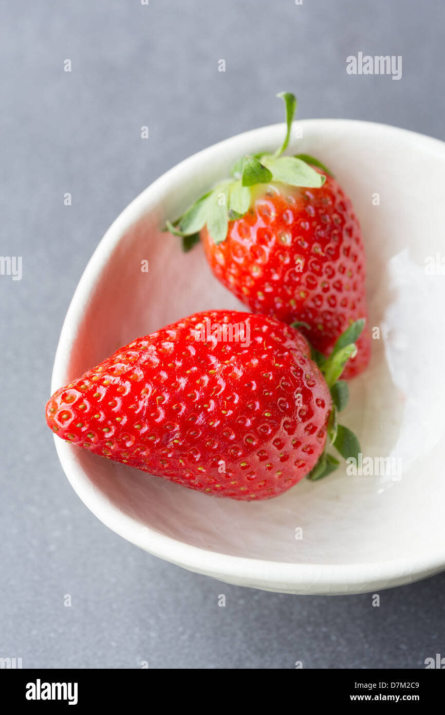 Group of people eating strawberries hi-res stock photography and images ...