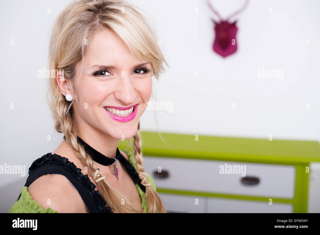 Young woman with traditional bavarian dress, smiling, portrait Stock Photo
