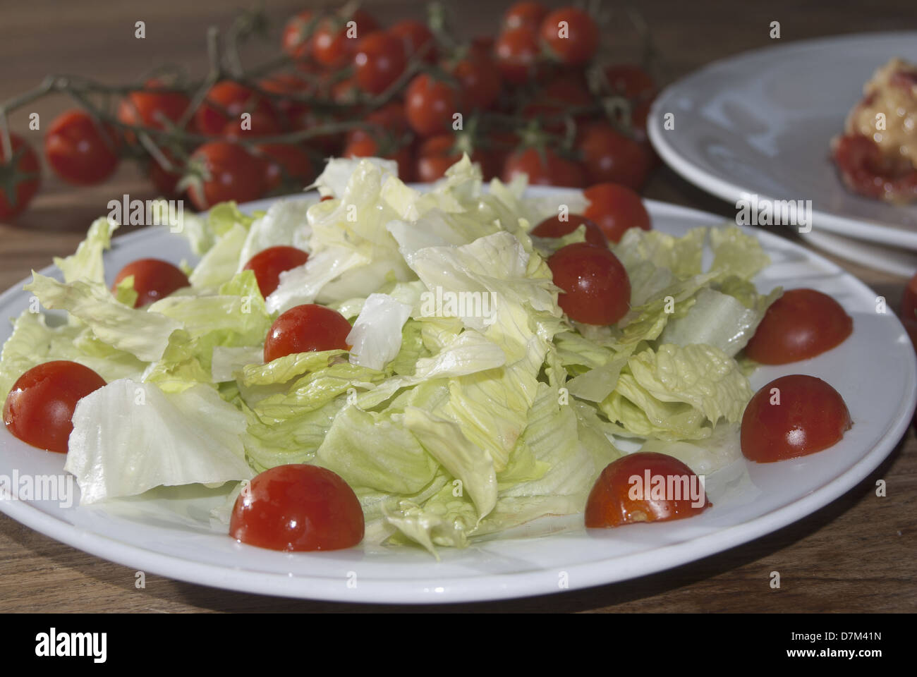 lettuce salad with pachino tomatoes, a healthy vegetarian meal Stock Photo