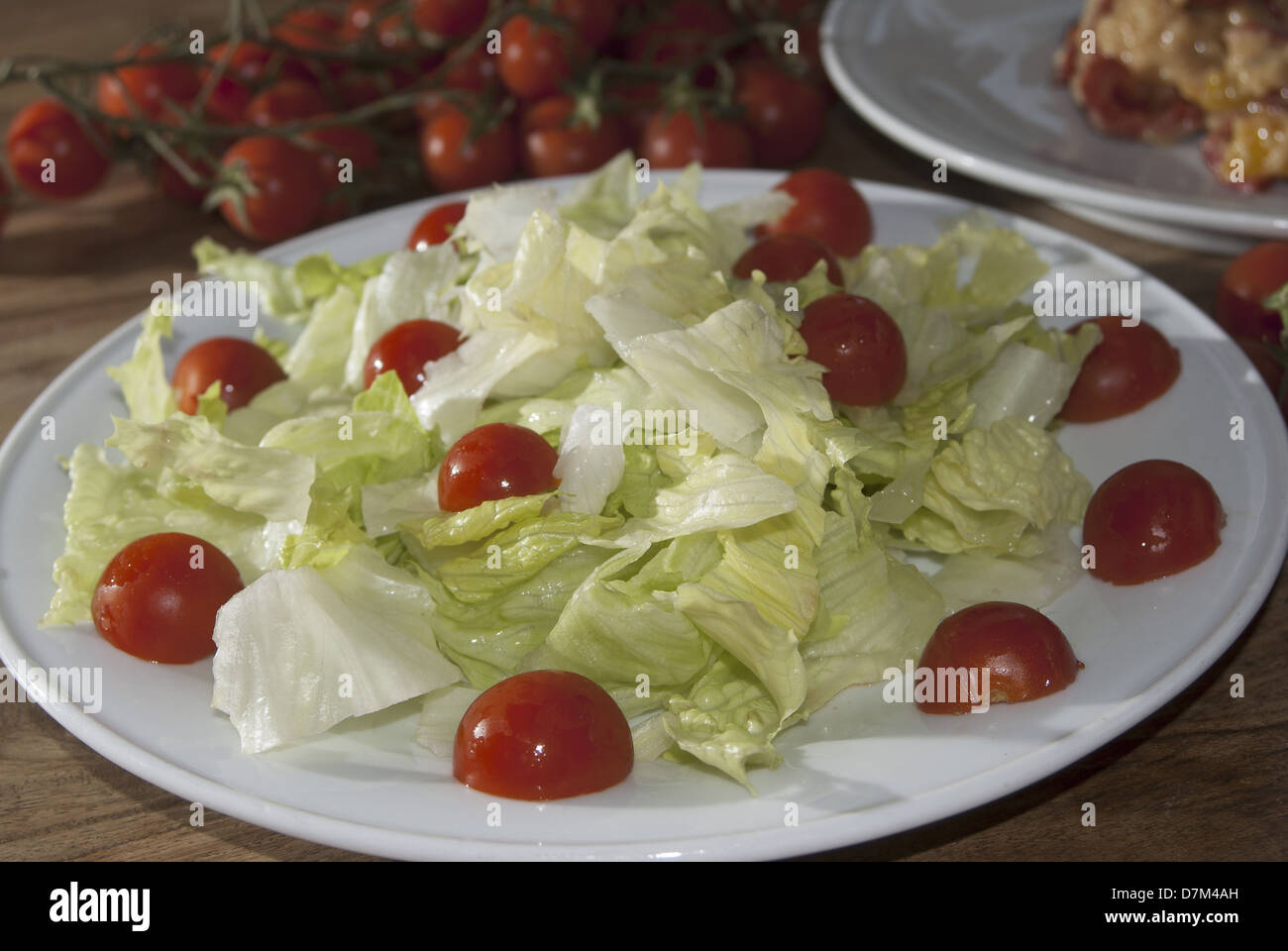 lettuce salad with pachino tomatoes, a healthy vegetarian meal Stock Photo