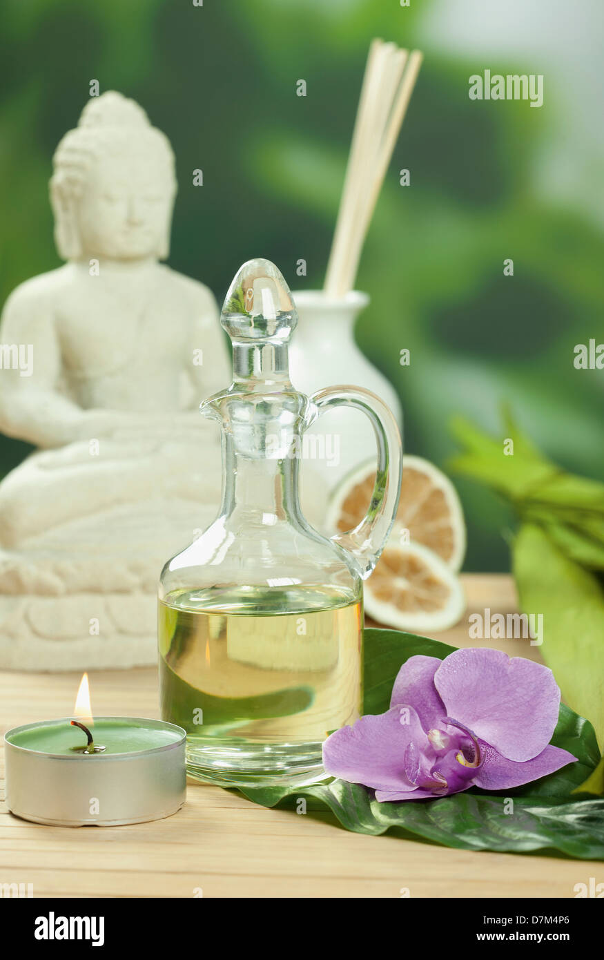 Arrangement of spa products with buddha statue Stock Photo