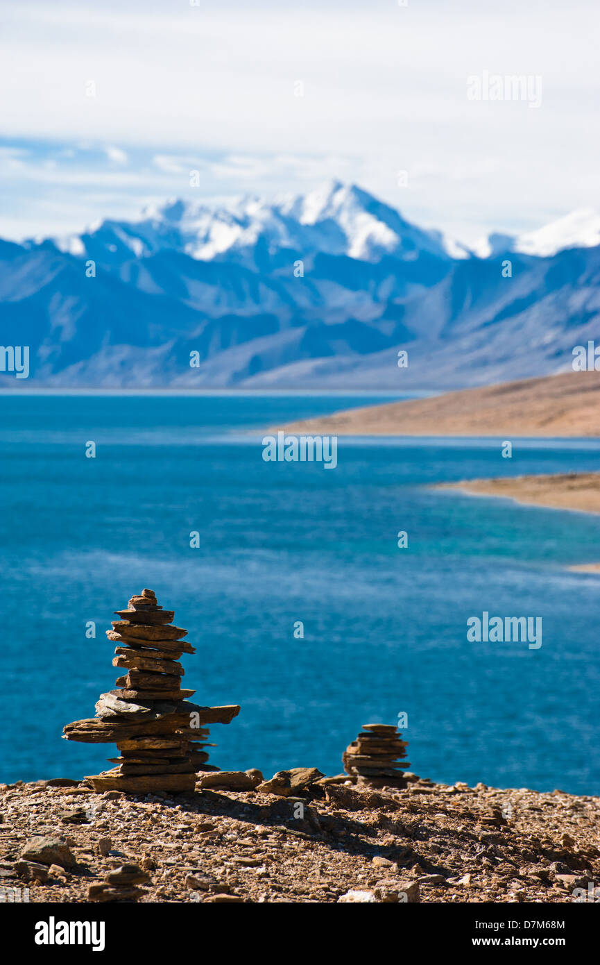 Buddhist stone pyramid at Tso Moriri Lake. Altitude 4600 m. View at Himalaya mountains range with Gya peak 6794 m. India, Ladakh Stock Photo