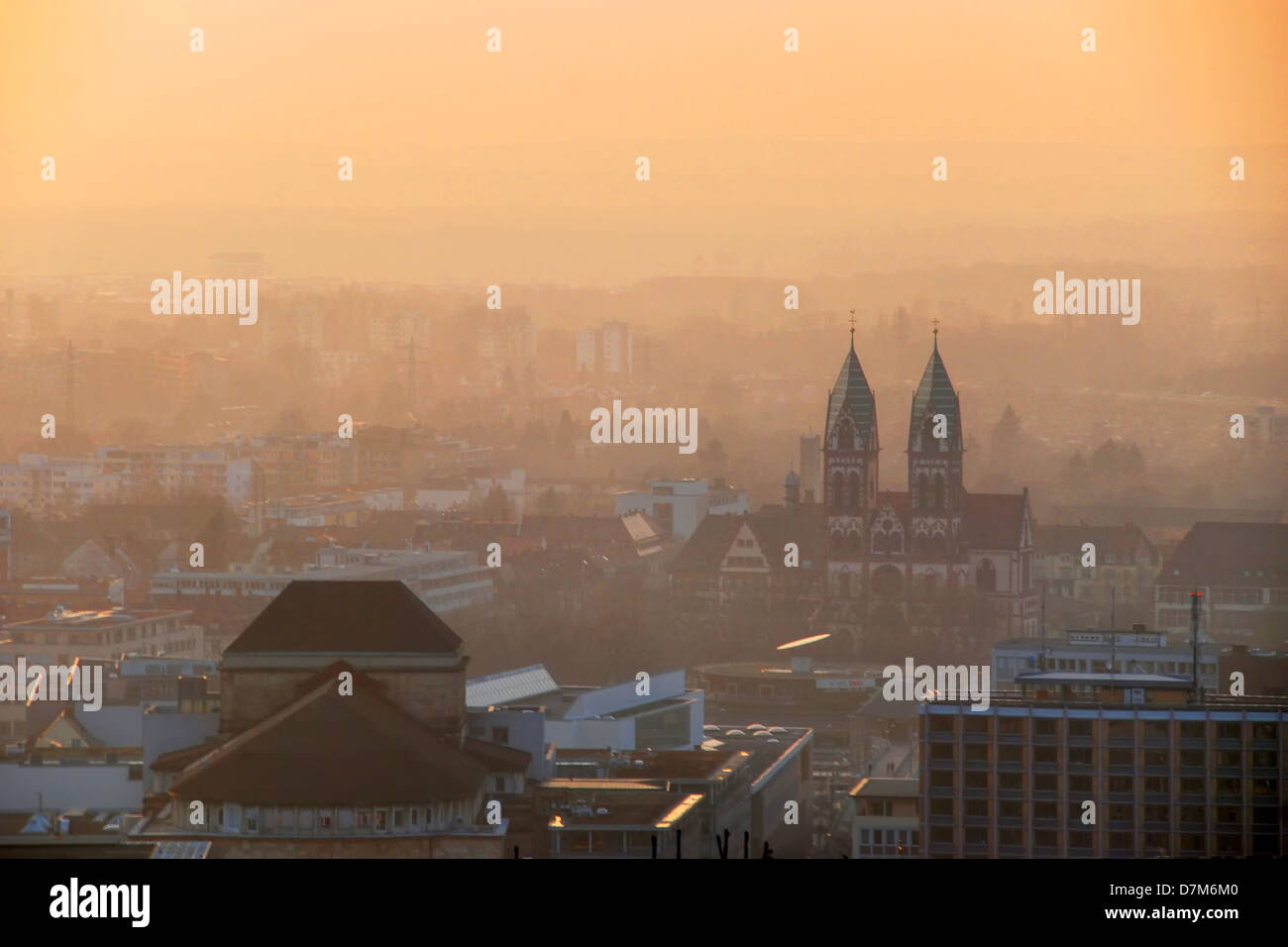 Freiburg cityscape at sunset, with the towers of Herz-Jesu Church Stock Photo