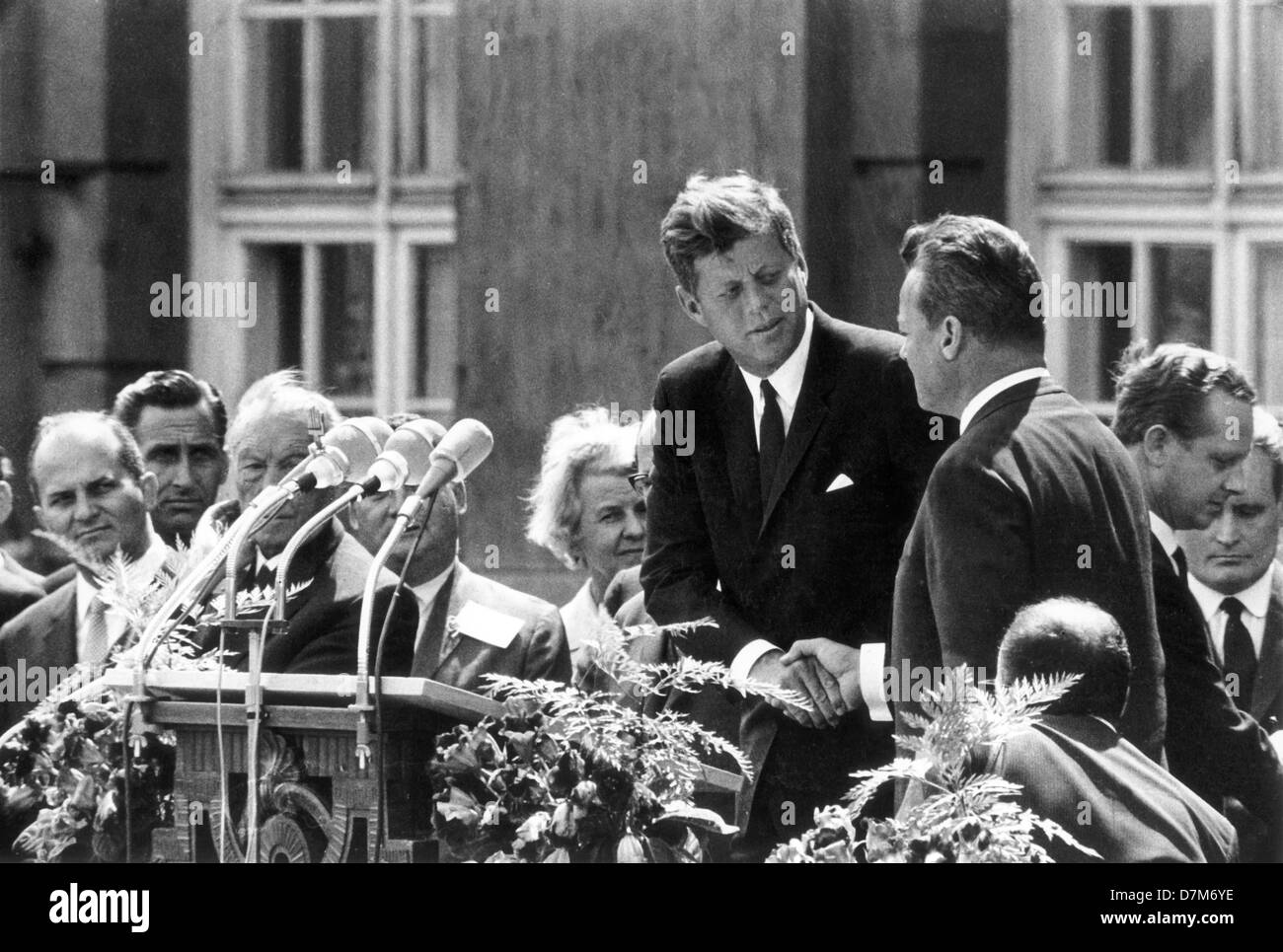American President John F. Kennedy (m) and the Berlin mayor Willy Brandt  (r) in front of Schöneberg city hall in Berlin on 26 June 1963. With his  legendary German spoken sentence "Ich