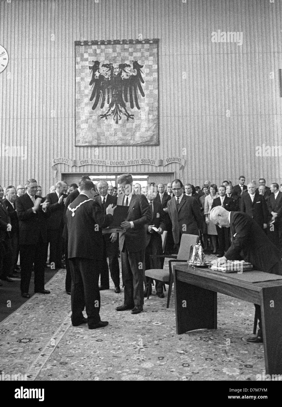President John F. Kennedy (M) at the citiy hall in Cologne on 23 June 1963 preparing to sign the golden book of the town. He started a four days visit in Germany. Stock Photo