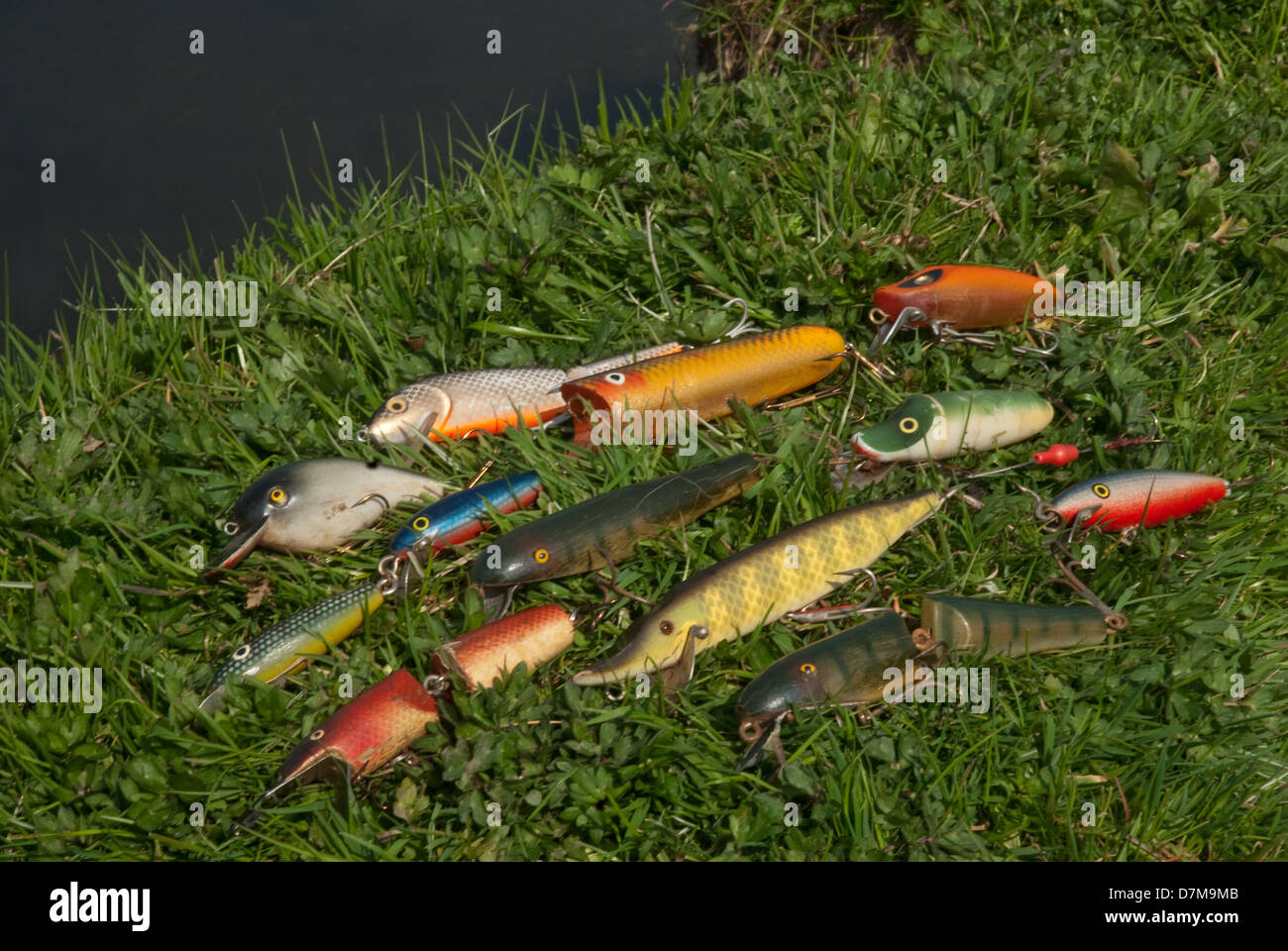 Antique Fishing Rod and Lures on a Grunge Wood Surface Stock Photo by  ©Willard 111695566