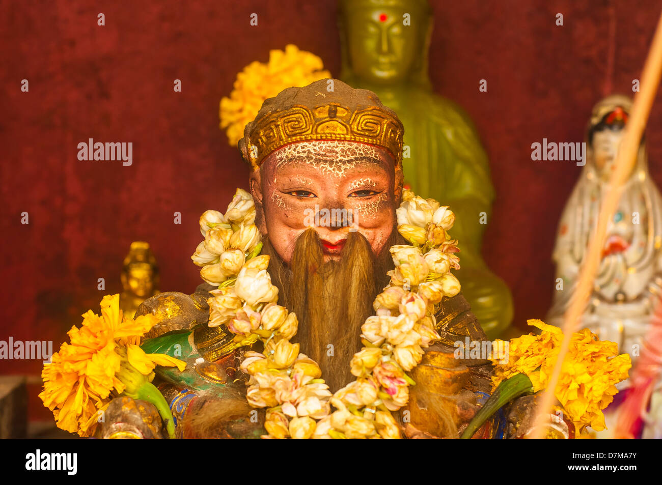 Statue of a Chinese Oriental god in the temple Stock Photo