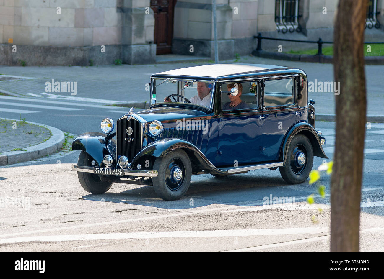 Couple driving a 1933 Mathis EMY4-F French vintage car Stock Photo