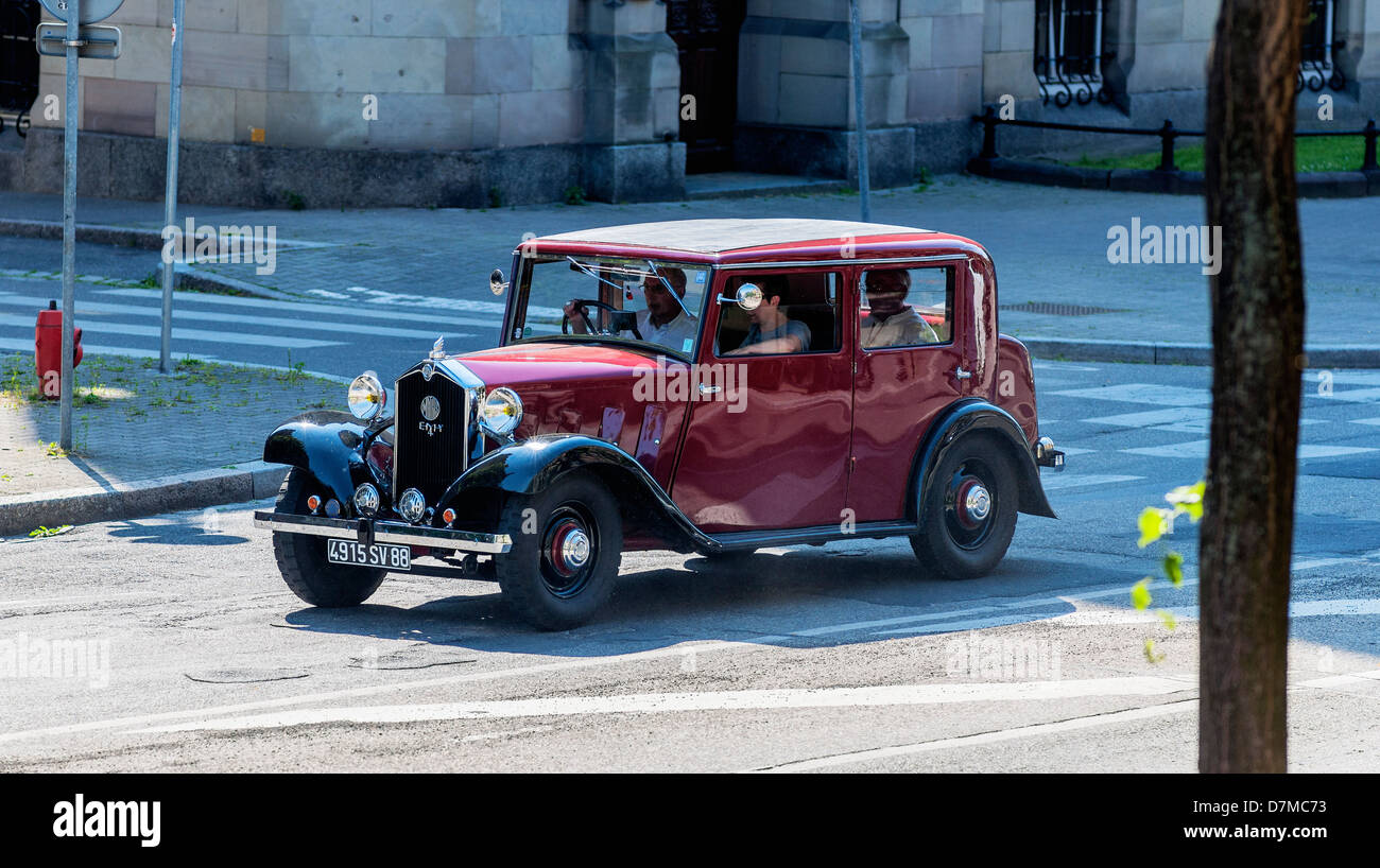 Family driving a 1933 Mathis EMY4-F French vintage car Stock Photo