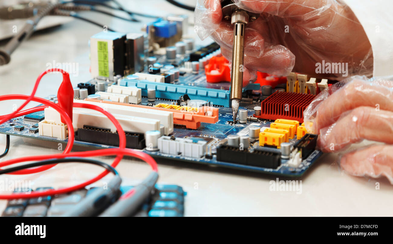 Soldering a circuit board Stock Photo Alamy