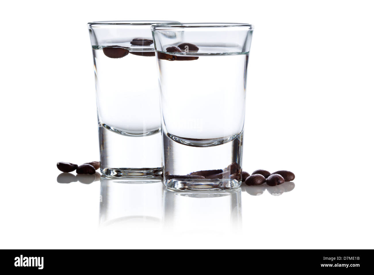 Two glasses of Sambuca and coffee beans on white background Stock Photo -  Alamy