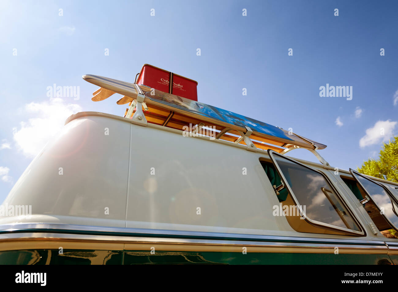 Detail of vintage Volkswagen van with surf board and ice box on its roof rack Stock Photo