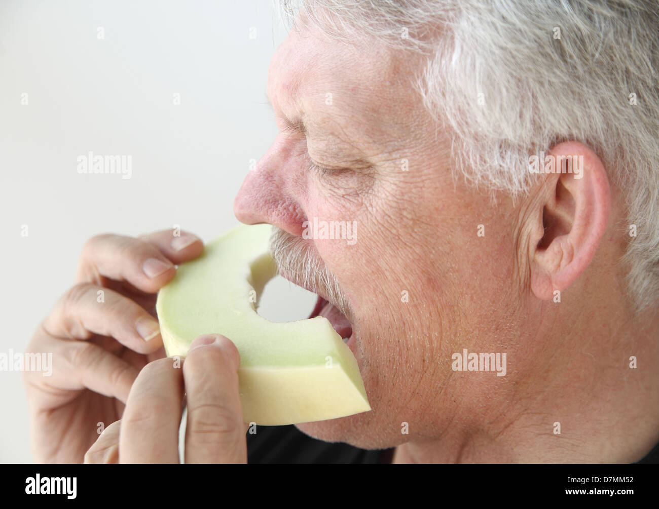 Melon head man holding melon hires stock photography and images Alamy