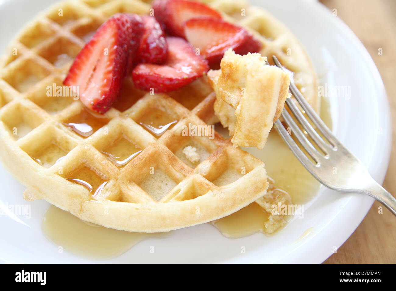large breakfast waffle with fresh strawberries and syrup Stock Photo ...