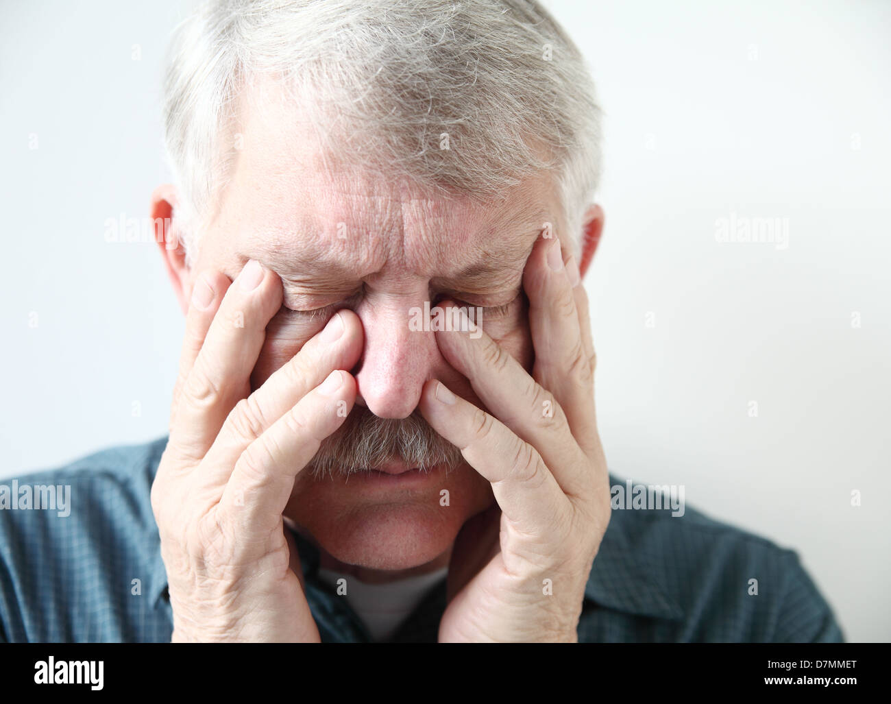 older man has pain in his sinuses Stock Photo
