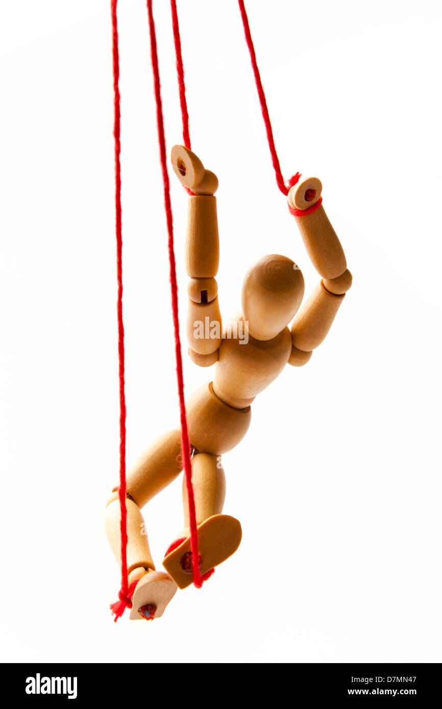 Wooden Figure Hanging in a Red Rope Stock Photo