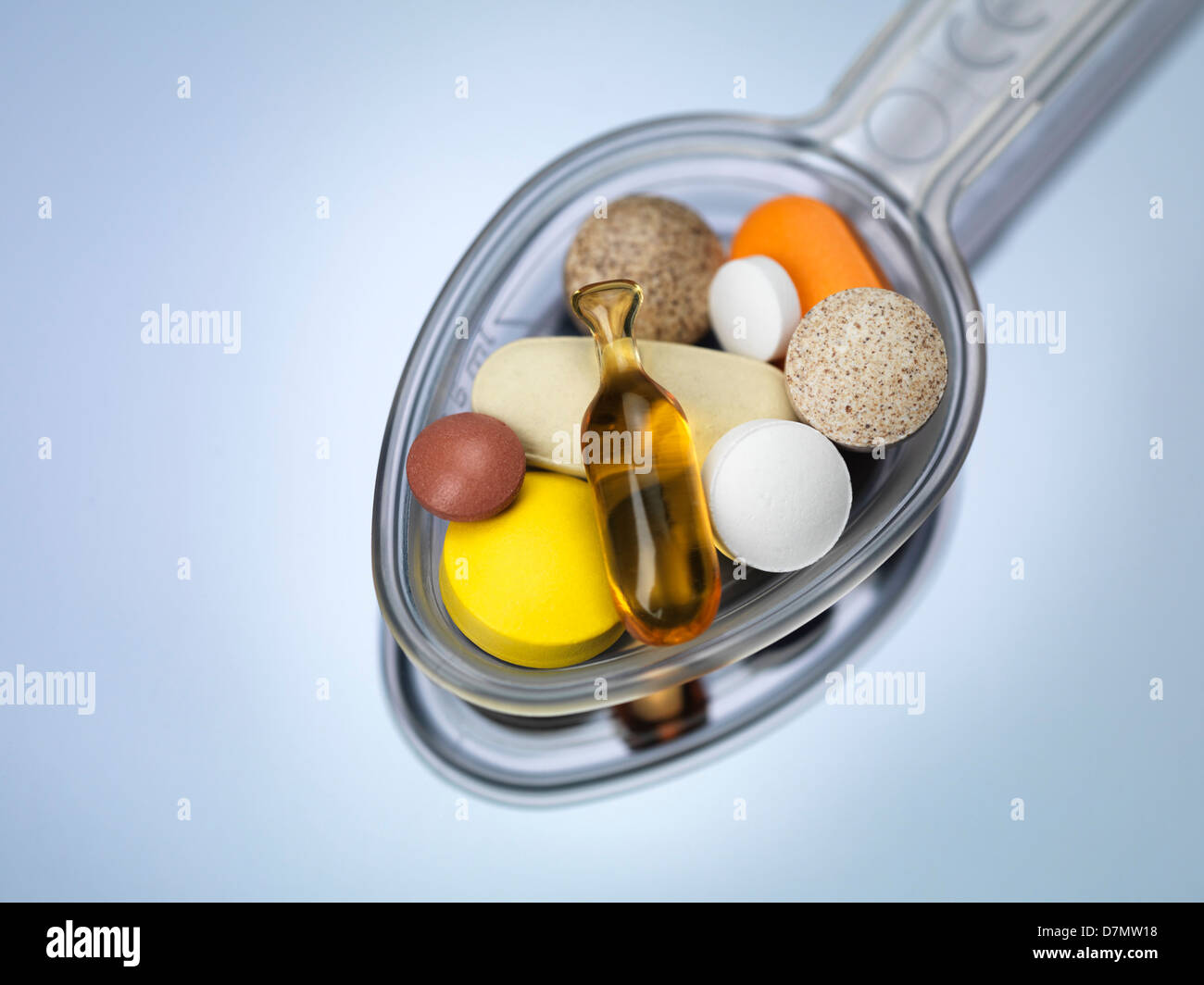 Spoonful of supplements Stock Photo