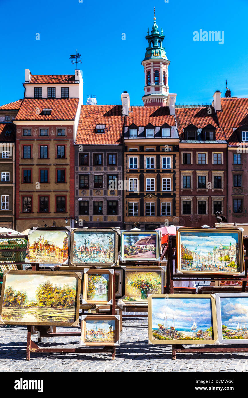 Display of artists' oil paintings for sale to tourists in Stary Rynek, Stare Miasto,Old Town Market Place in Warsaw, Poland. Stock Photo