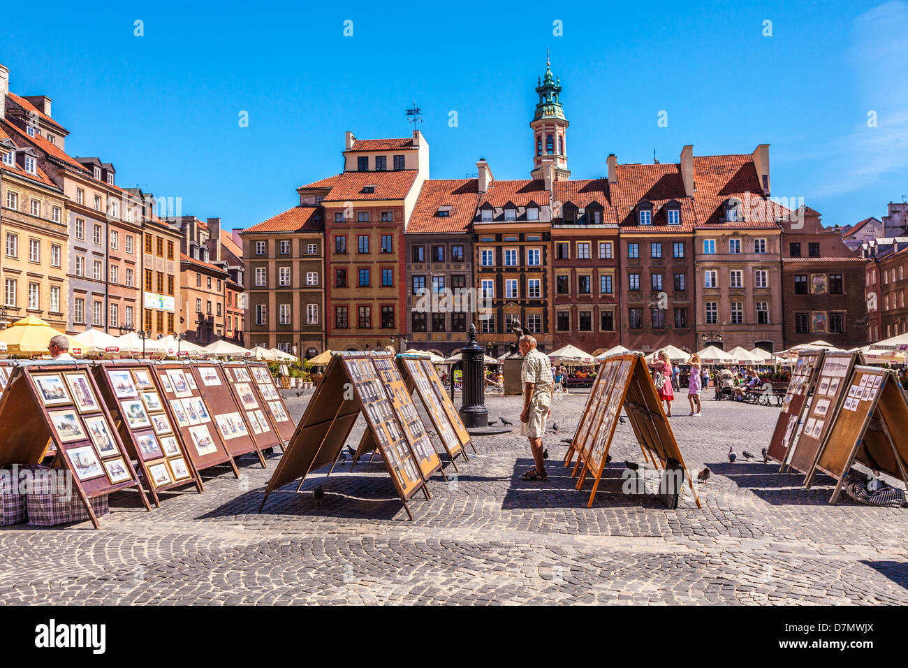 Display of artists' paintings for sale to tourists in Stary Rynek, Stare Miasto,Old Town Market Place in Warsaw, Poland. Stock Photo