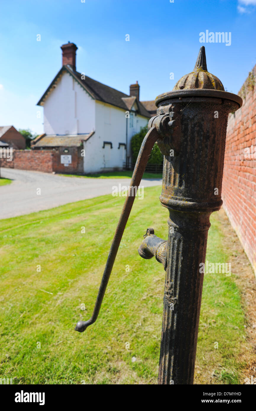 Cast iron water pump in Shropshire village England UK Stock Photo