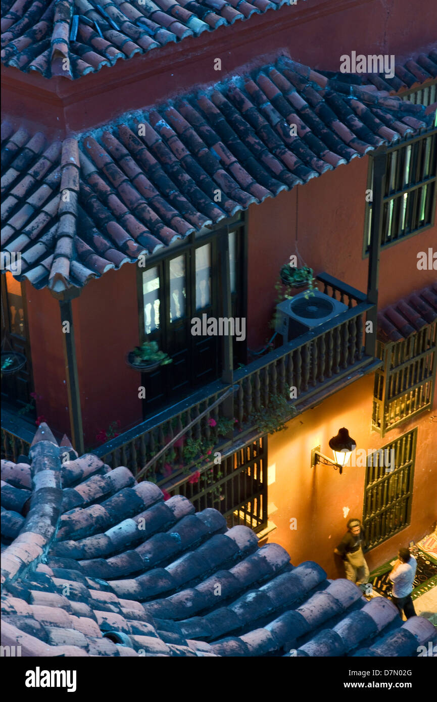 Cartagena, Colombia at night. Rooftops and people in street Stock Photo