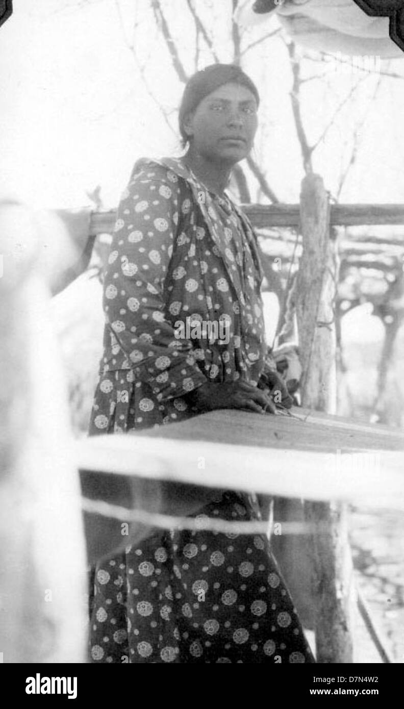 A photograph of a woman weaving, taken during the Elmer Riggs and ...