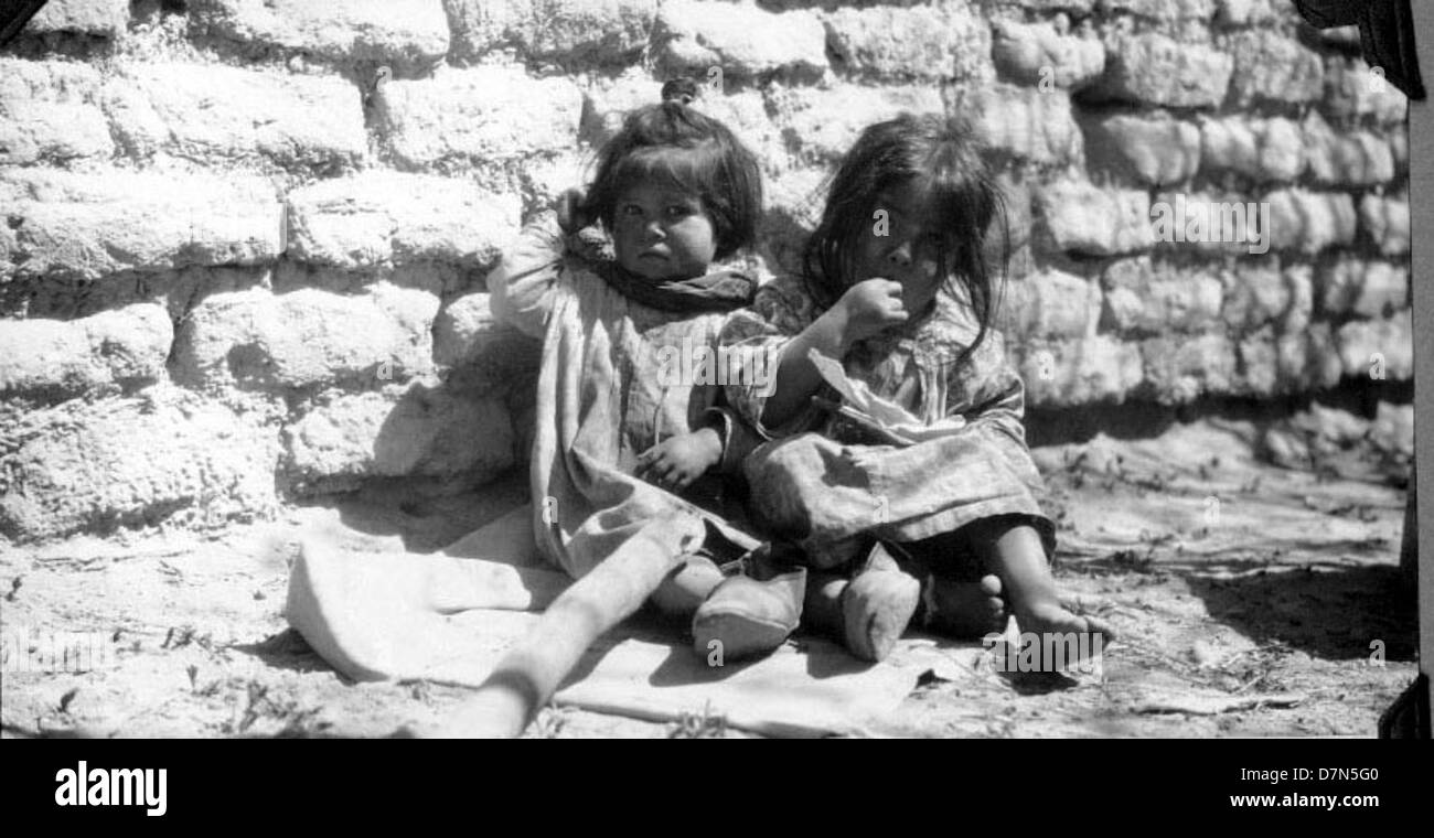 This photograph shows two girls collecting fossils during the Marshall ...