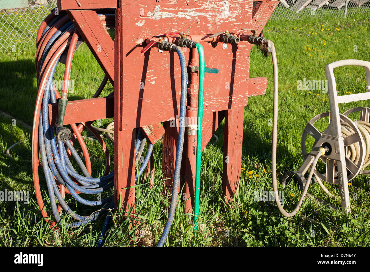 Makeshift watering system at a community garden in Western Massachusetts. Stock Photo