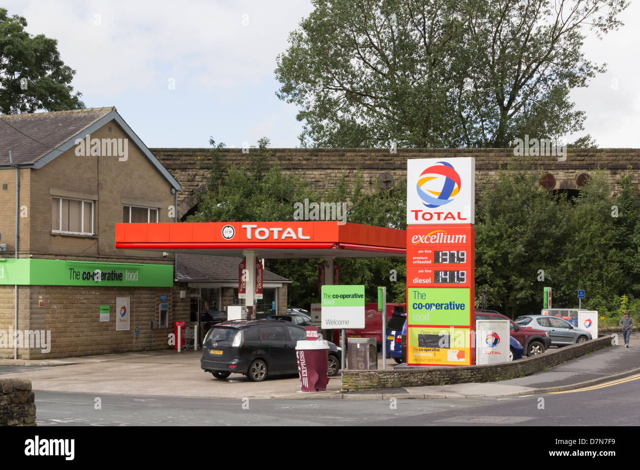 A combined total petrol station and Co-operative food store on the B6480 Church Street in Settle, North Yorkshire. Stock Photo