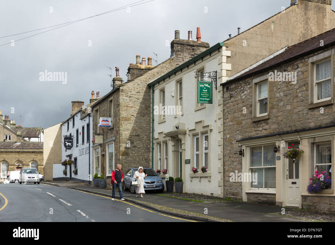 High Street in Settle, North Yorkshire; The guest house' King William the Fourth' and the pub 'Talbot Arms' are prominent. Stock Photo