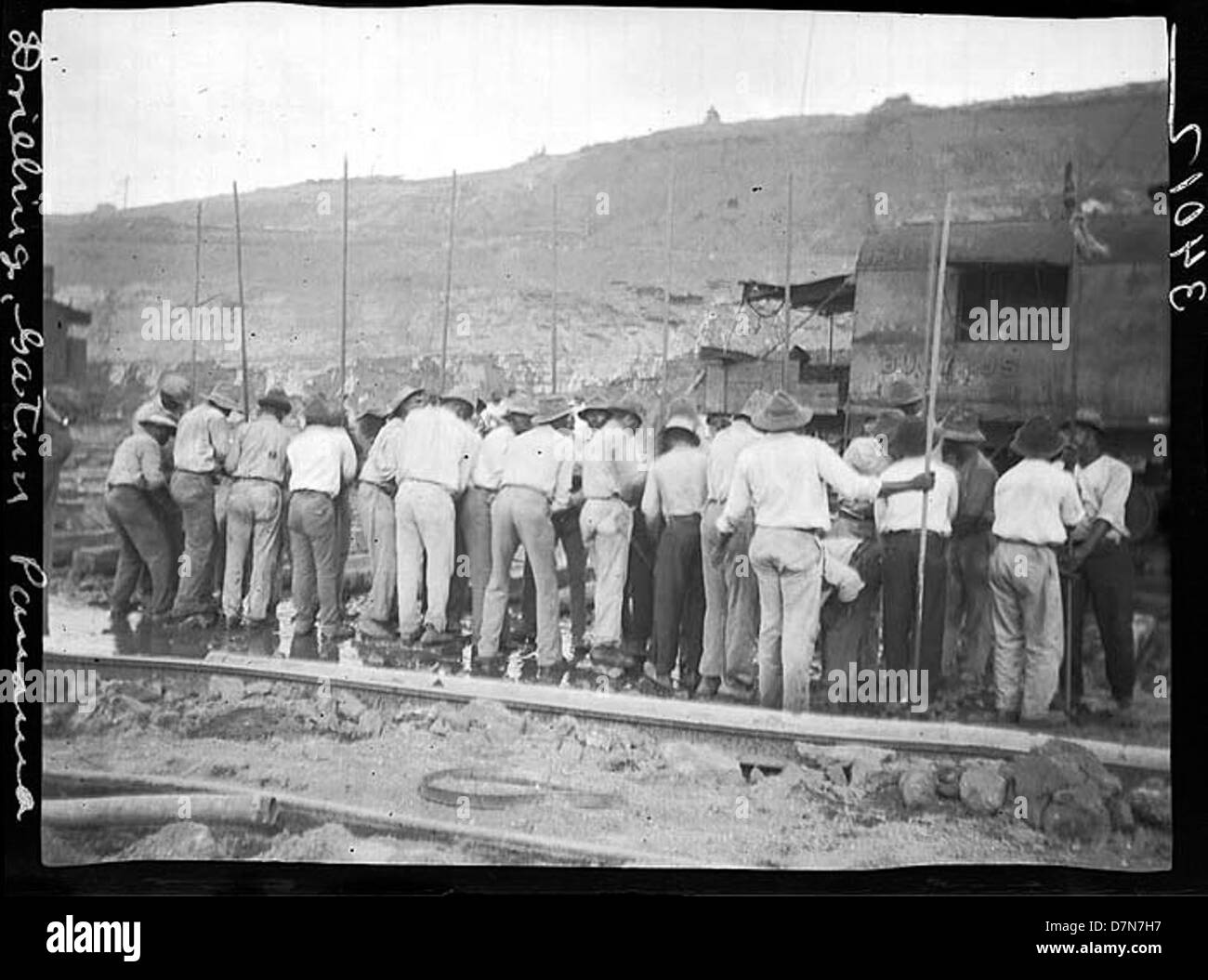 Line of men drilling Stock Photo
