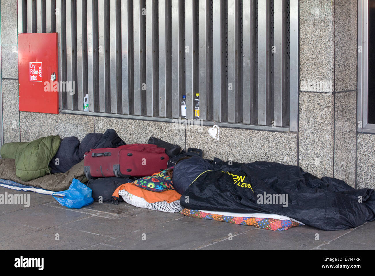 Homeless People  sleeping on the streets of London England Wrapped up against the cold in Sleeping Bags Stock Photo