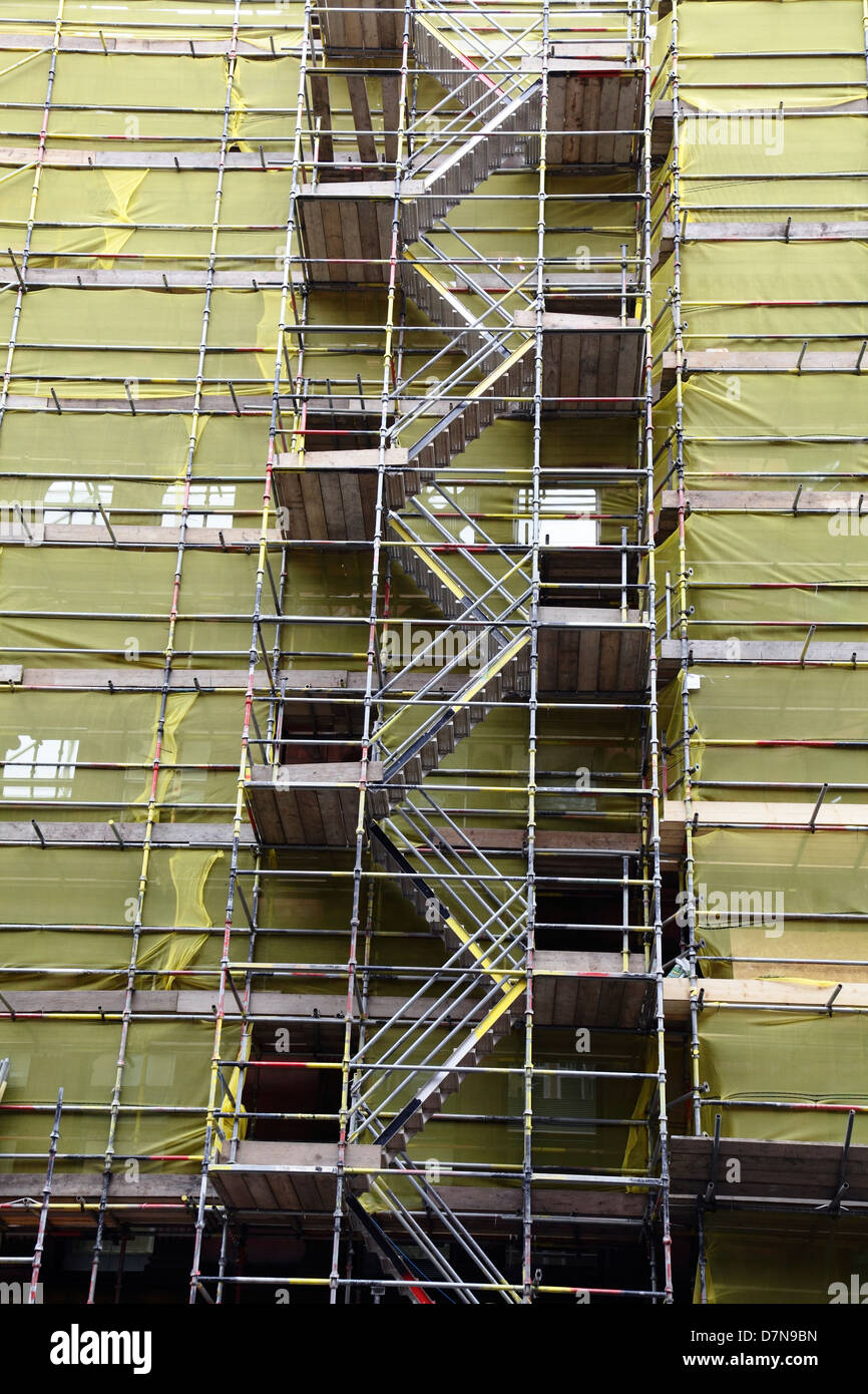Scaffolding with debris netting on a building in Glasgow, Scotland, UK