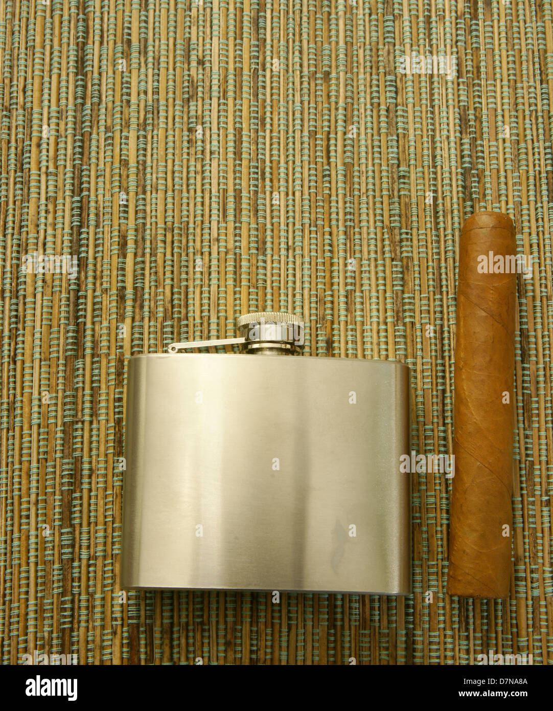 Cigar and hip-flask. Male accessories. Stock Photo