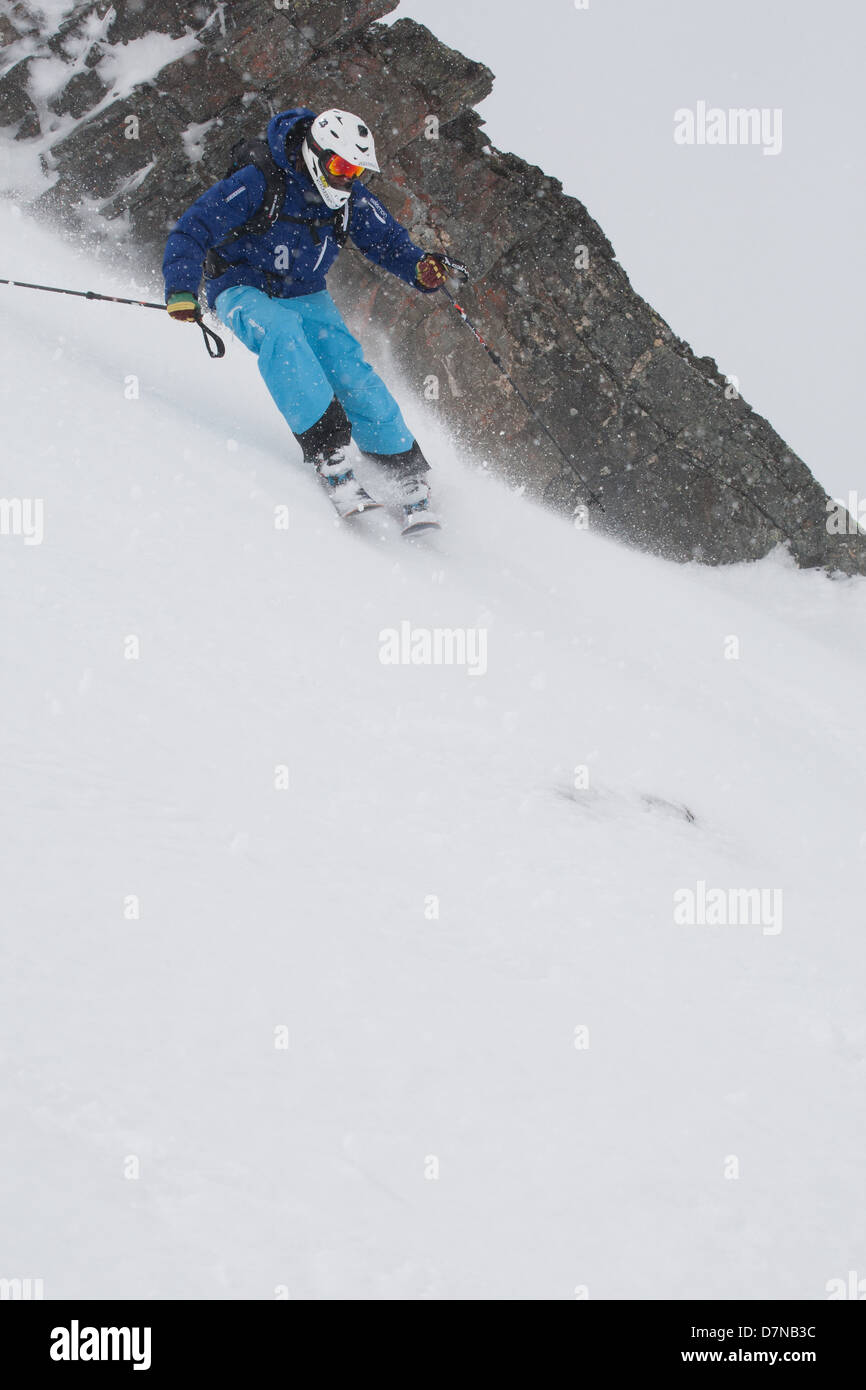 Skier is about to turn on off piste skiing Stock Photo