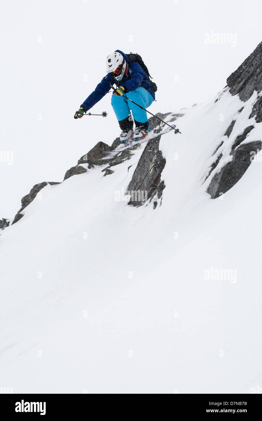 Skier jumping a cliff Stock Photo
