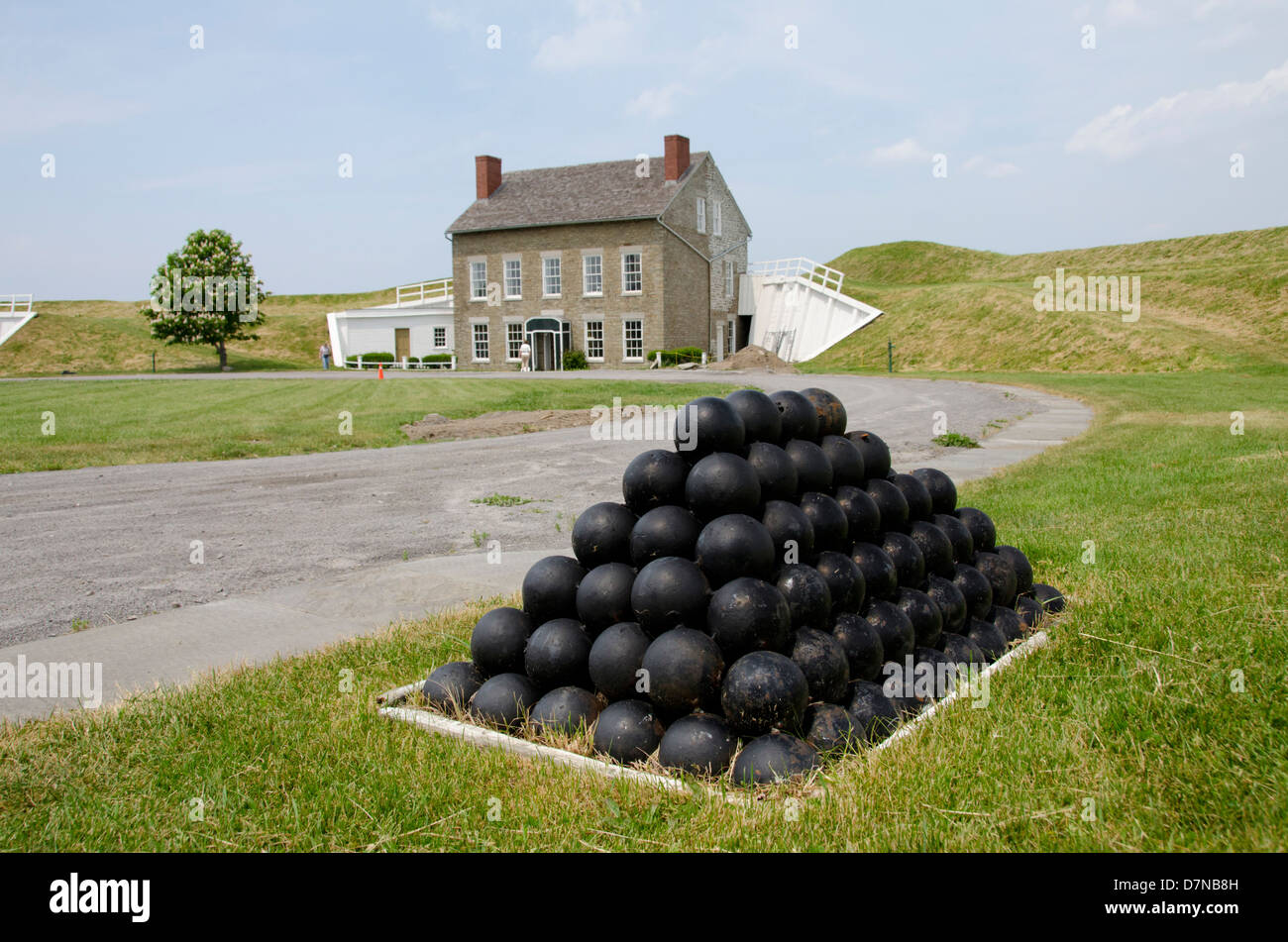 New York, Oswego. Fort Ontario State Historic Site. Military soldier's homes inside fort walls, cannonballs. Stock Photo