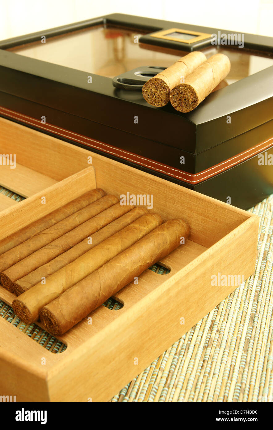 Cuban cigars, black elegant cigar humidor, cigar cutter. Close up. Stock Photo
