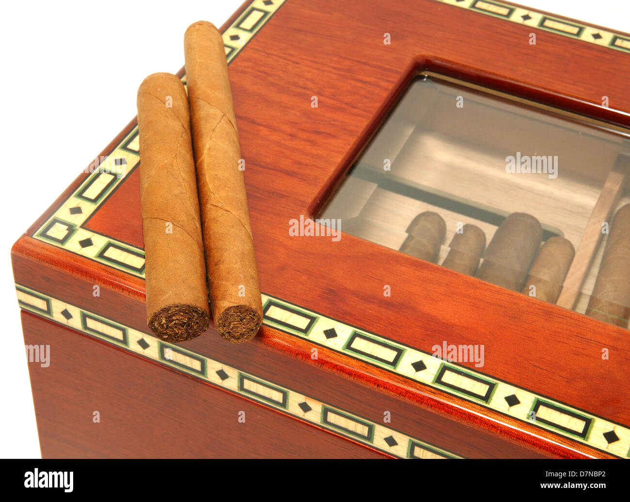 Close-up of two cigars laying on an elegant humidor box Stock Photo