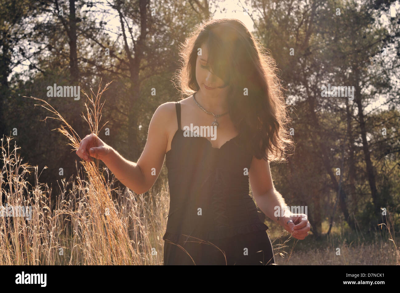 Young woman in a forest Stock Photo - Alamy