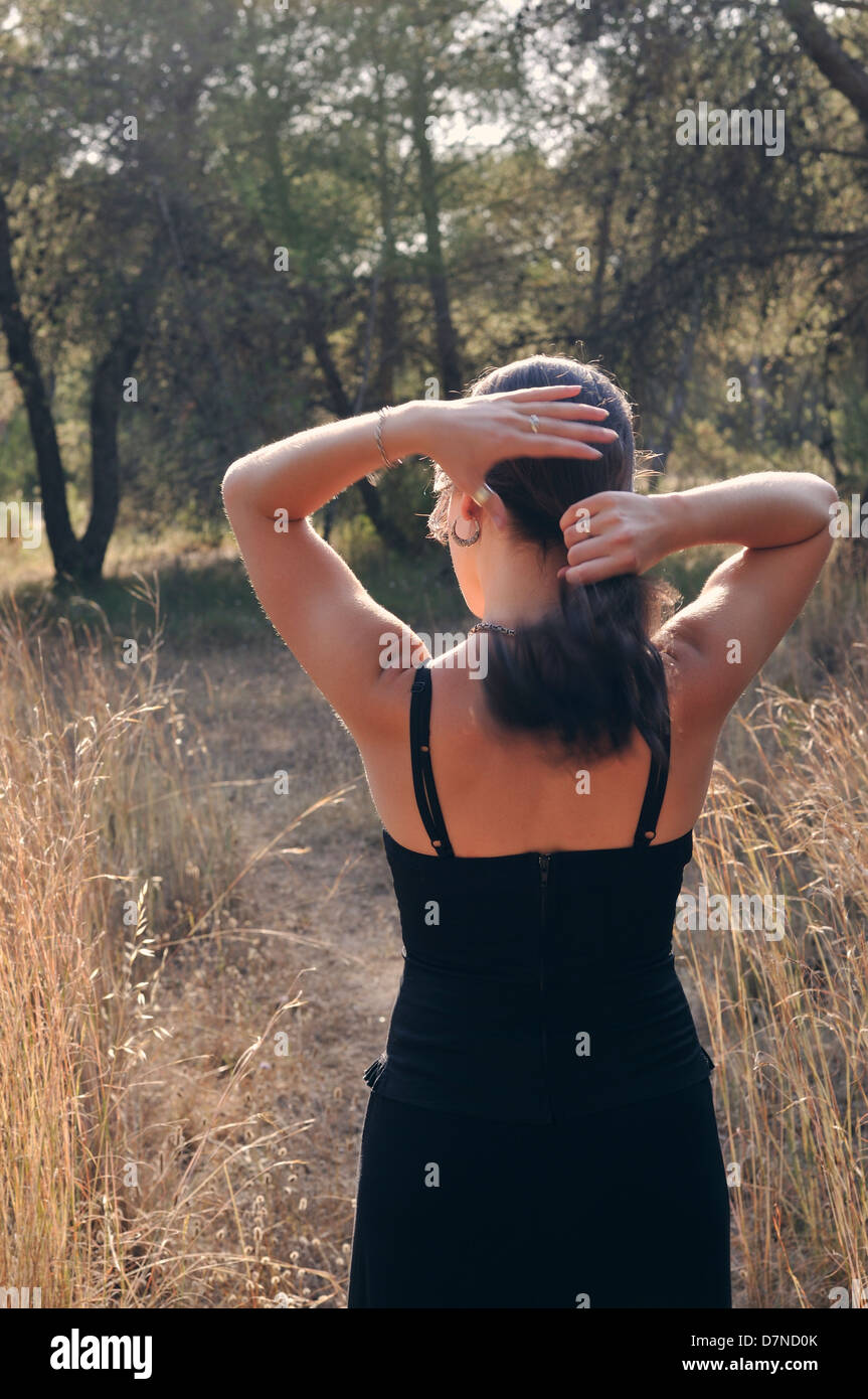 Young woman in a forest Stock Photo - Alamy