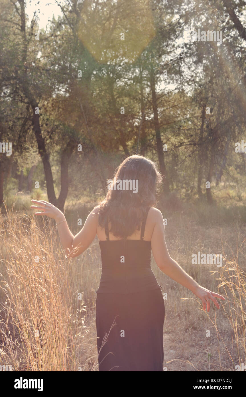 Young woman in a forest Stock Photo - Alamy