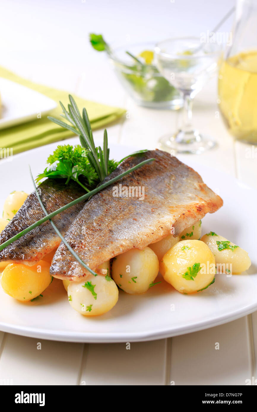 Fish meal - Pan fried trout fillets with potatoes Stock Photo