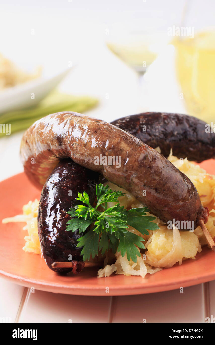 Blood sausage and white pudding with sauerkraut and potatoes Stock