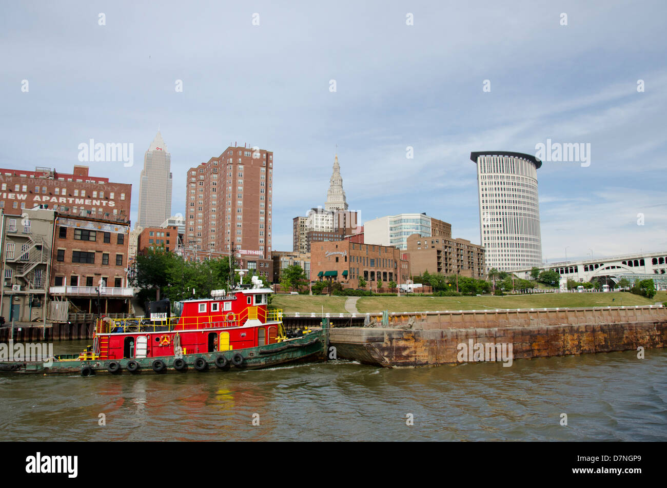 Ohio, Cleveland. Cuyahoga River waterfront with city skyline. Stock Photo