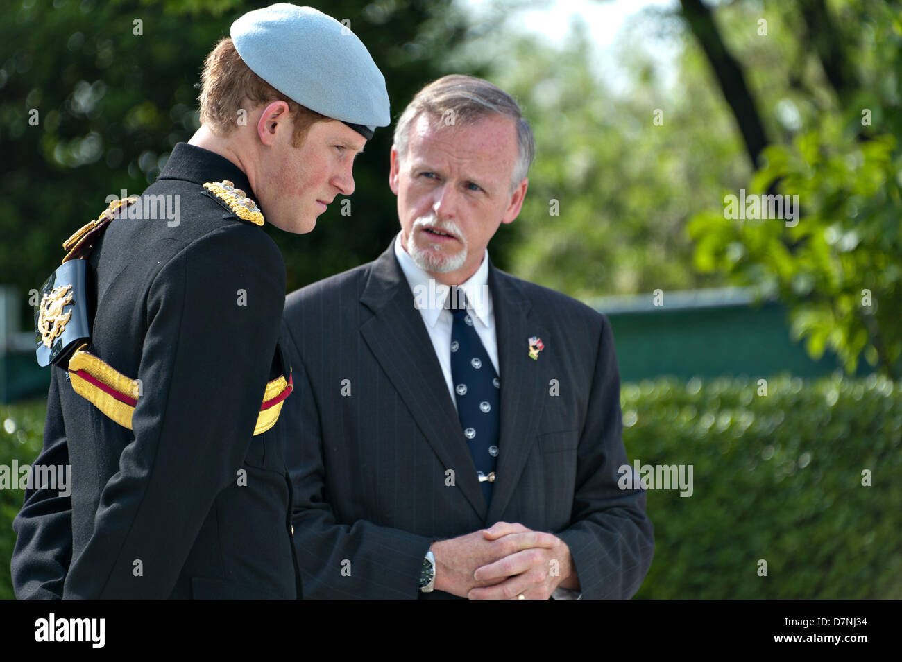 HRH Prince Harry of Wales speaks with Patrick K. Hallinan, the superintendent of Arlington National Cemetery at President John F. Kennedy's gravesite May 10, 2013 in Arlington, VA. Stock Photo