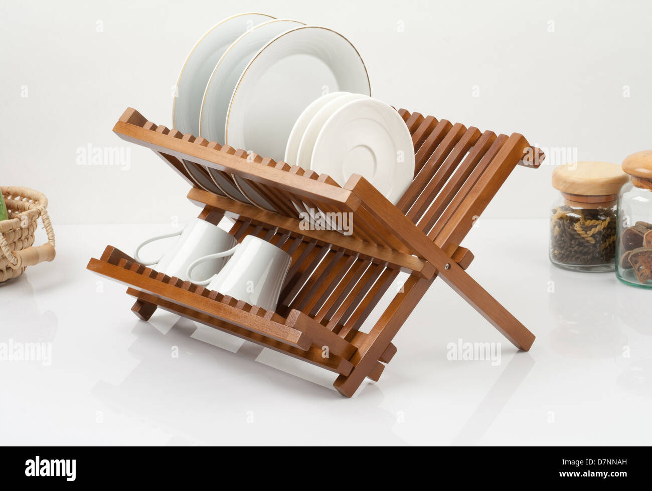 A small wooden shelf for keeping dishes and cups Stock Photo